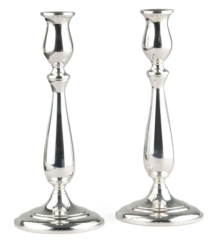 A PAIR OF SILVER CANDLESTICKS, BY CARTIER Christie's